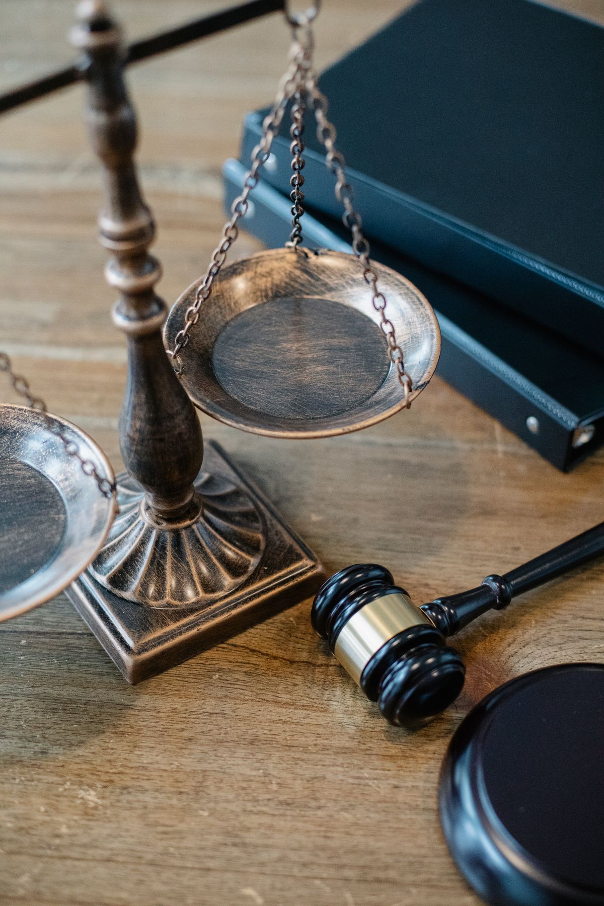 Gavel and scales of justice on a wooden desk, representing legal advocacy